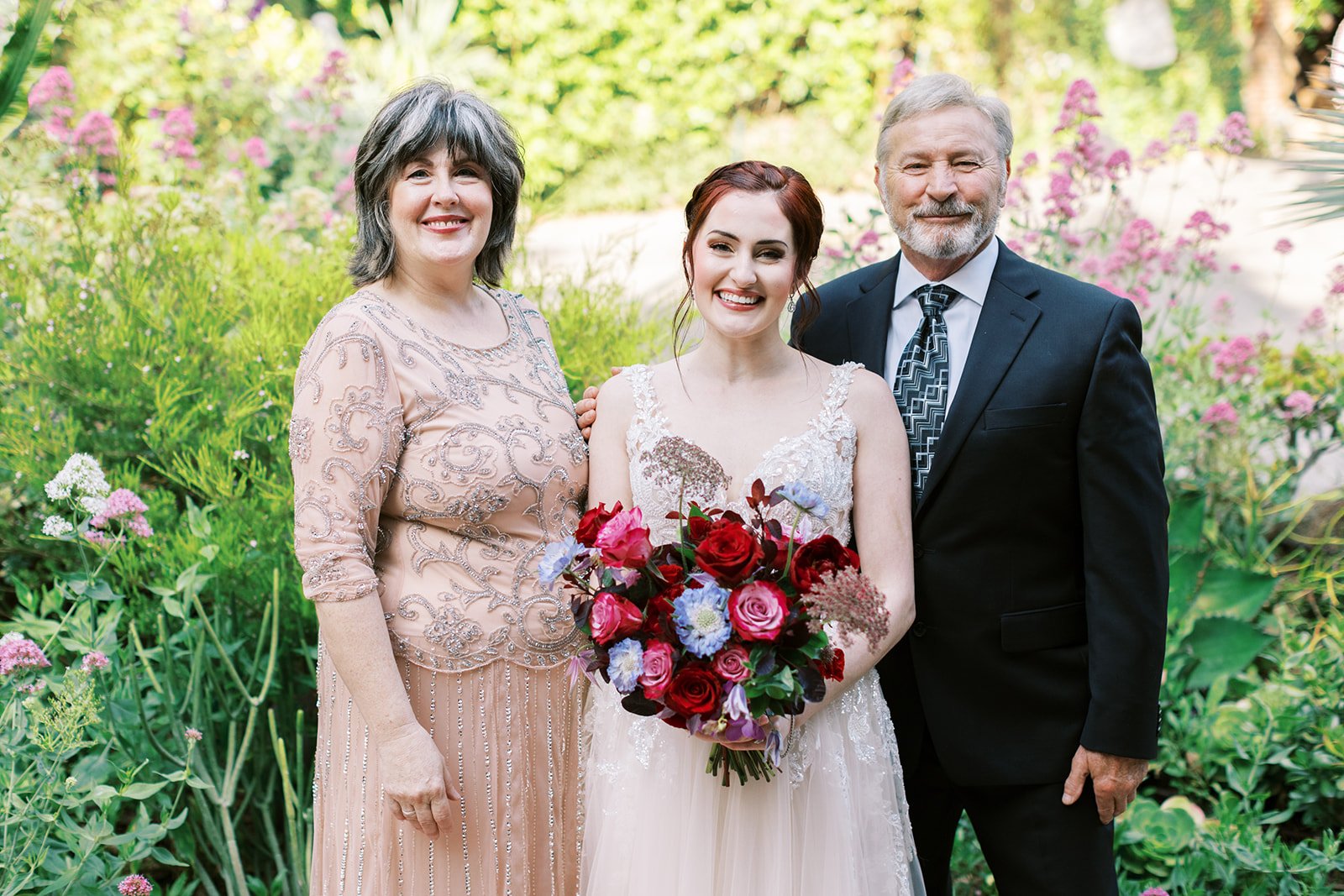 Bride with her parents at her elopement
