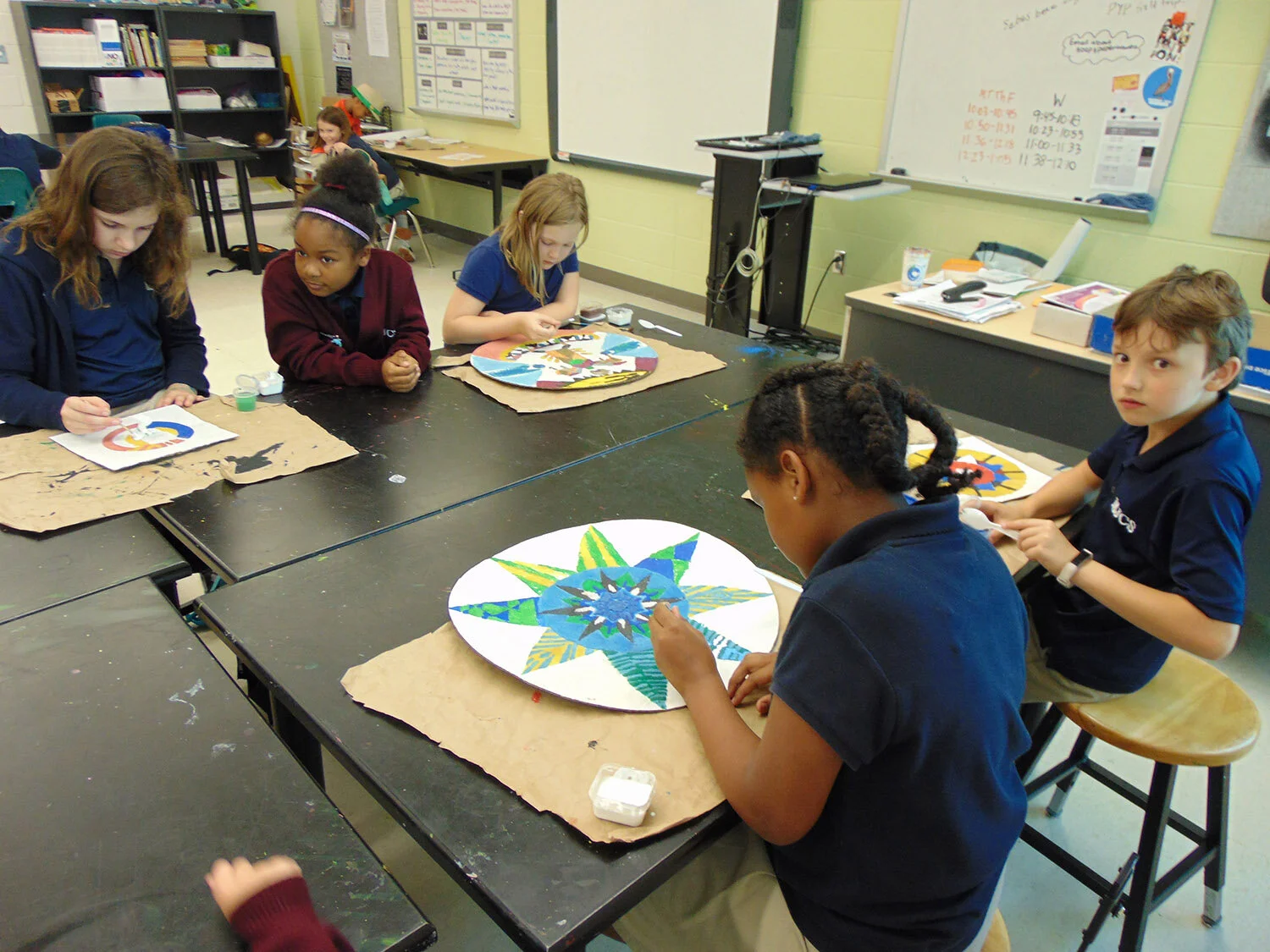  Afterschool and Summer Arts Enrichment Program: students carefully paint their mandala artwork.  