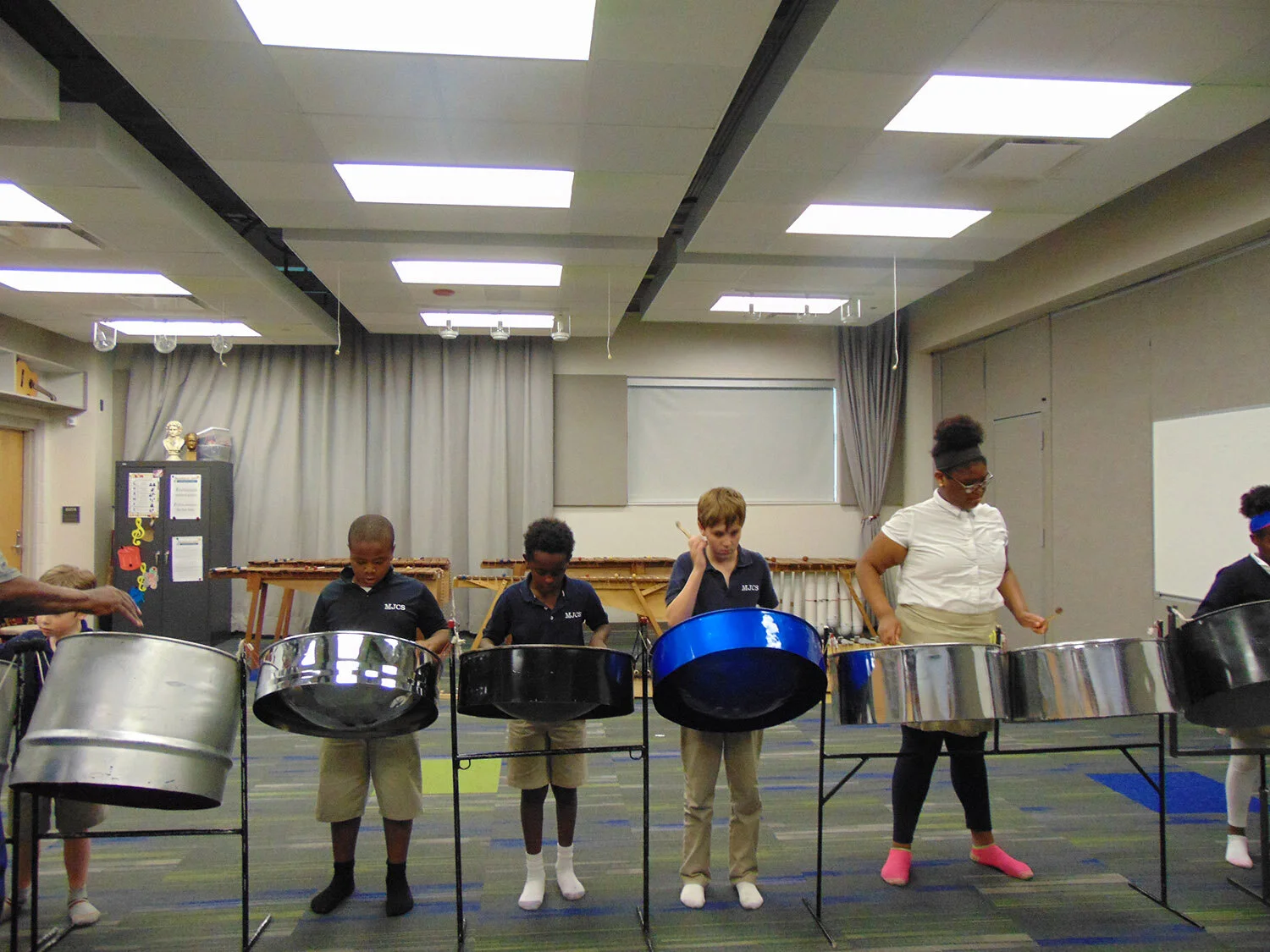  Afterschool and Summer Arts Enrichment Program: students practice drumming. 
