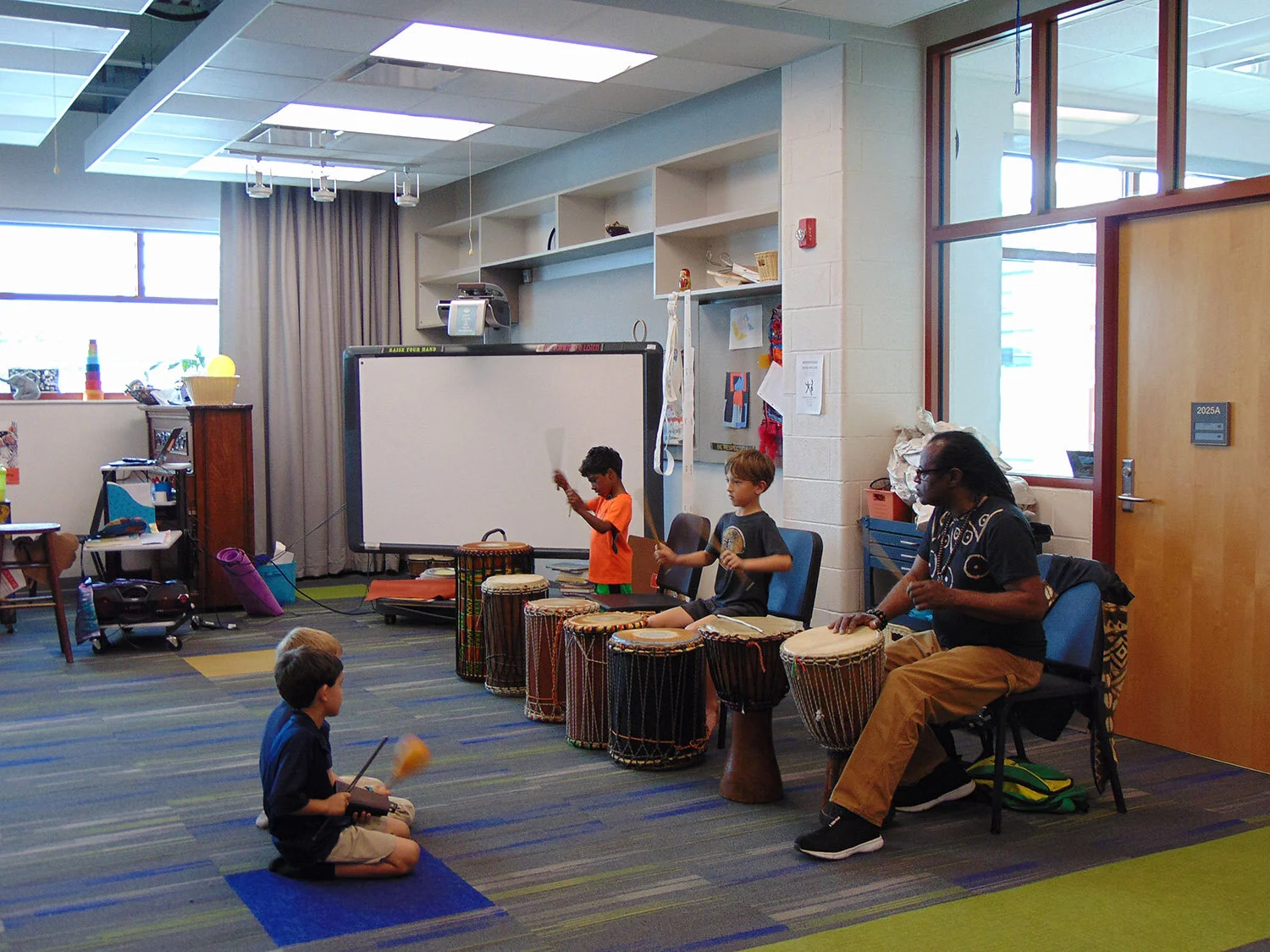  Afterschool and Summer Arts Enrichment Program: students play the drum.  