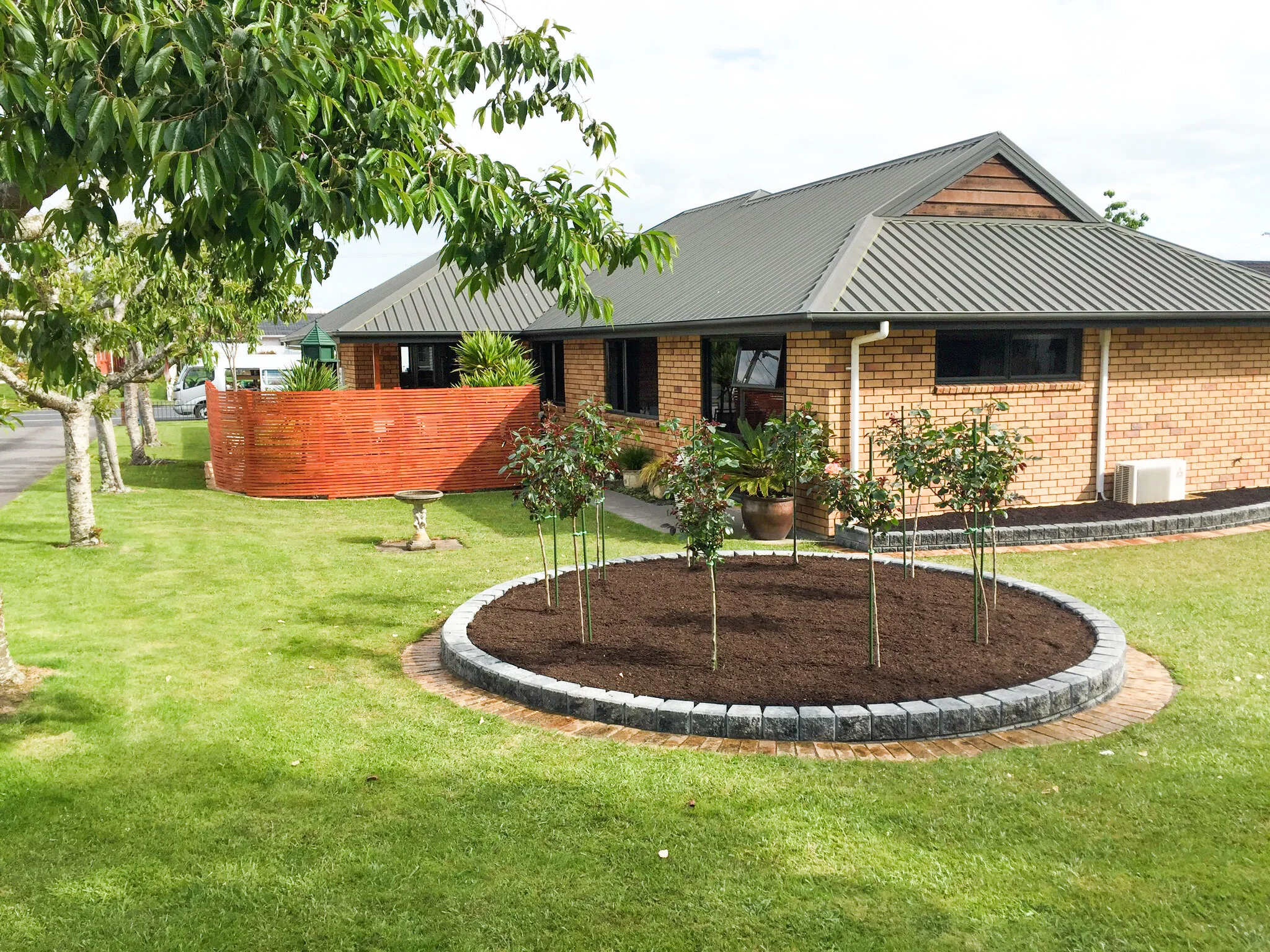 Raised gardens and curved fence