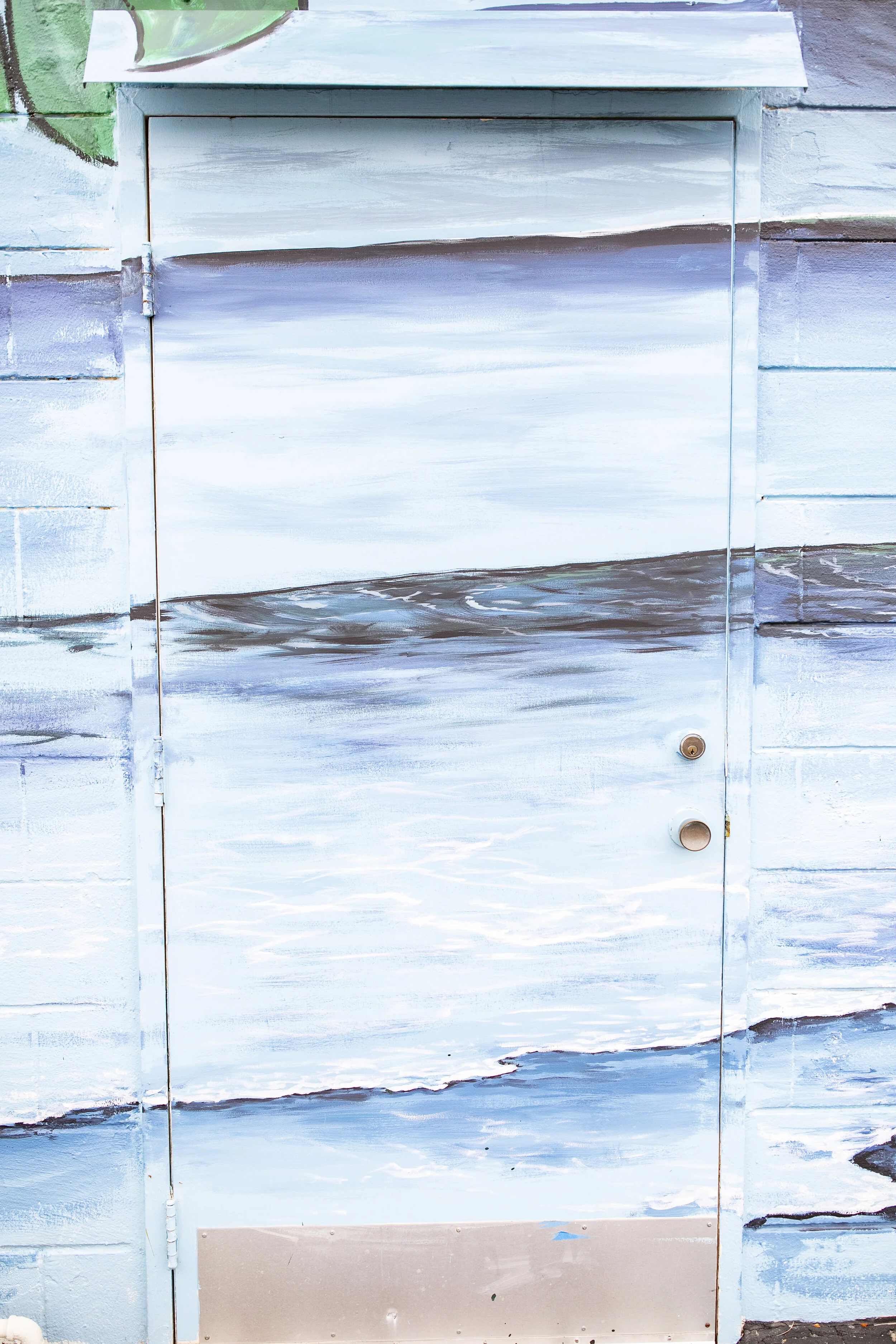 The Closet Shopper Eastside Santa Cruz Mural close up of ocean waves by local artist, Brittany Costanzo