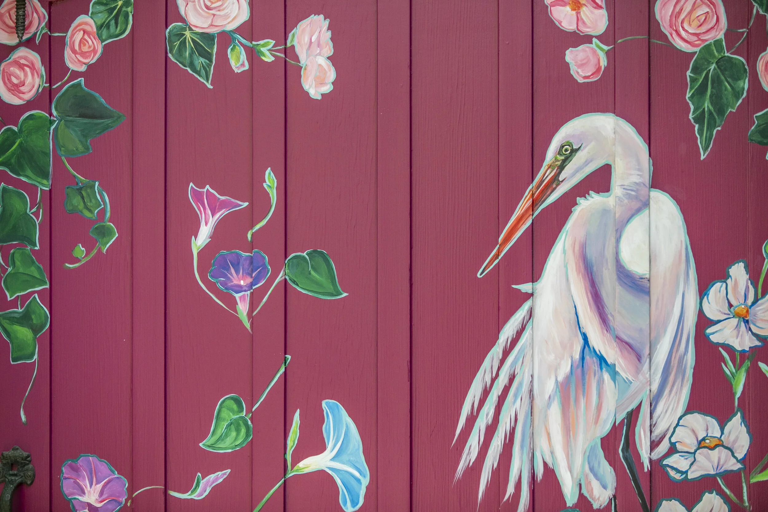  Riverwalk Mural Front Gate View of flowers, birds, and other whimsical plants in Capitola Village, CA by Brittany Costanzo