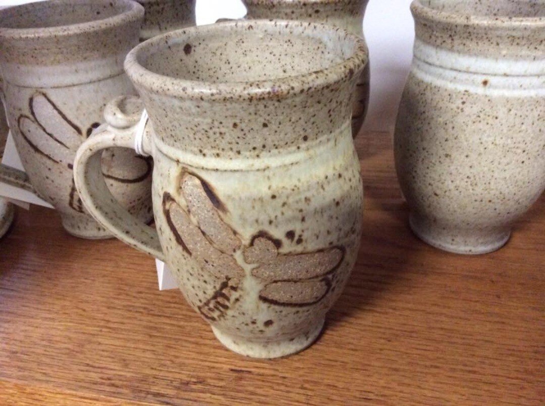 A #handcrafted dragonfly mug that fits comfortably in your hand, a reminder of spring on a cool morning with coffee or tea.

#makingpottery #madeinwestvirginia 
#handmadeinwestvirginia #claymaker
#madeinWV #cowenwv #stonewarepottery
#functionalcerami