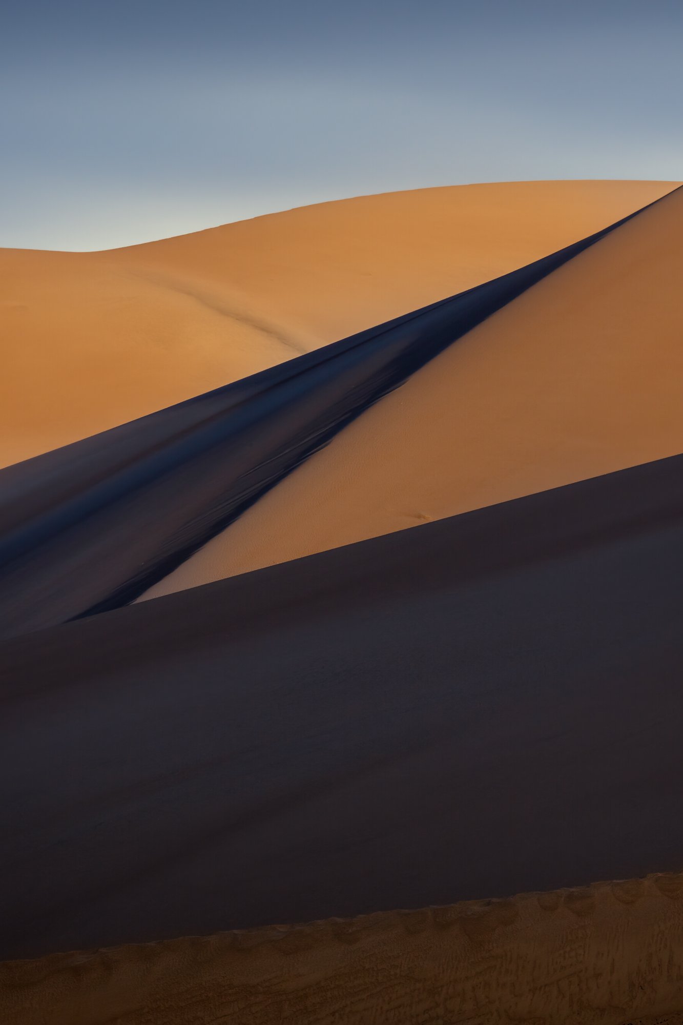 Shadows falling across Great Sand Dunes National Park and Preserve