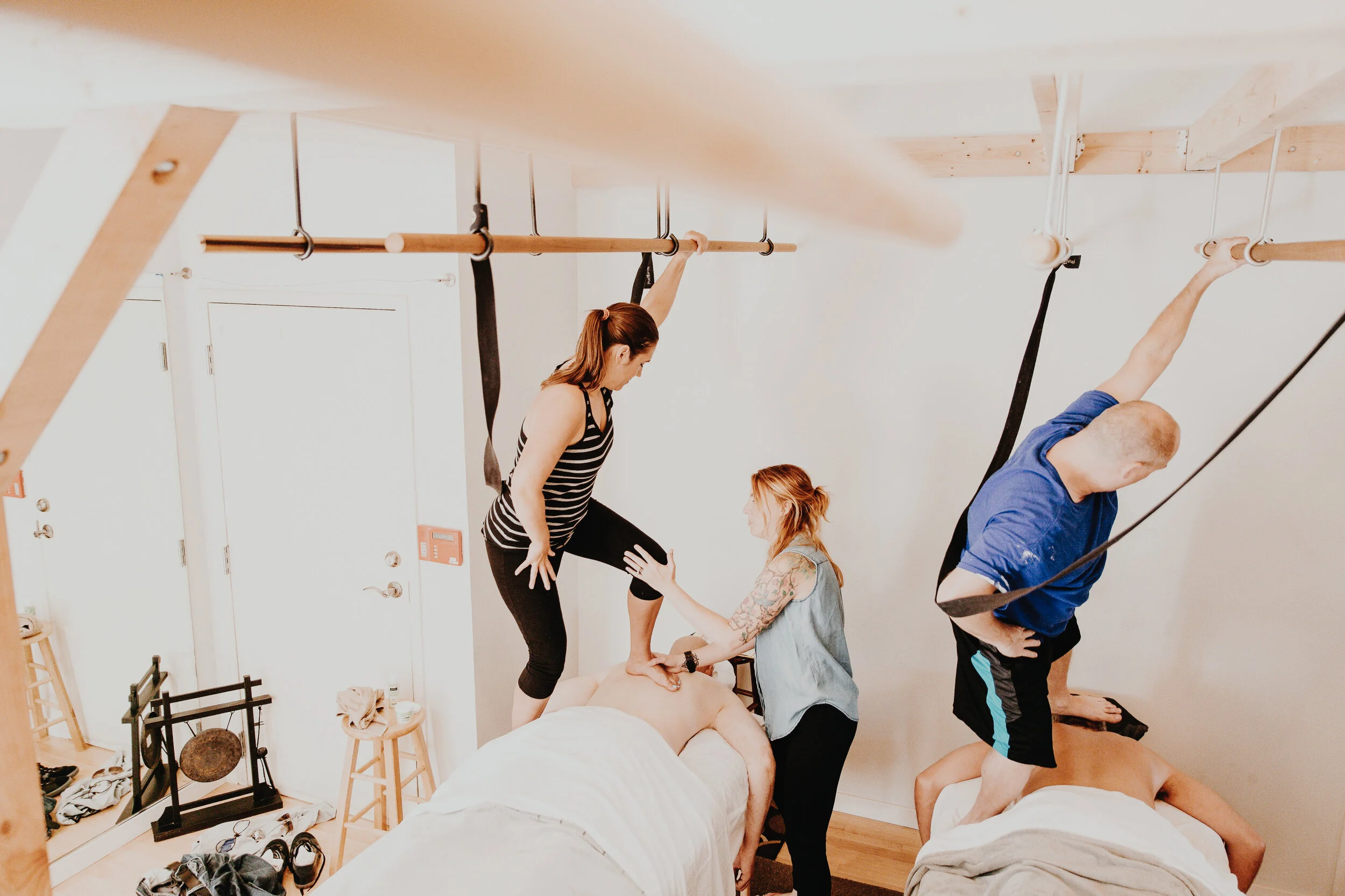 Advanced DeepFeet Ashiatsu massage techniques being taught by certified instructor at Blue Buddha Healing Arts