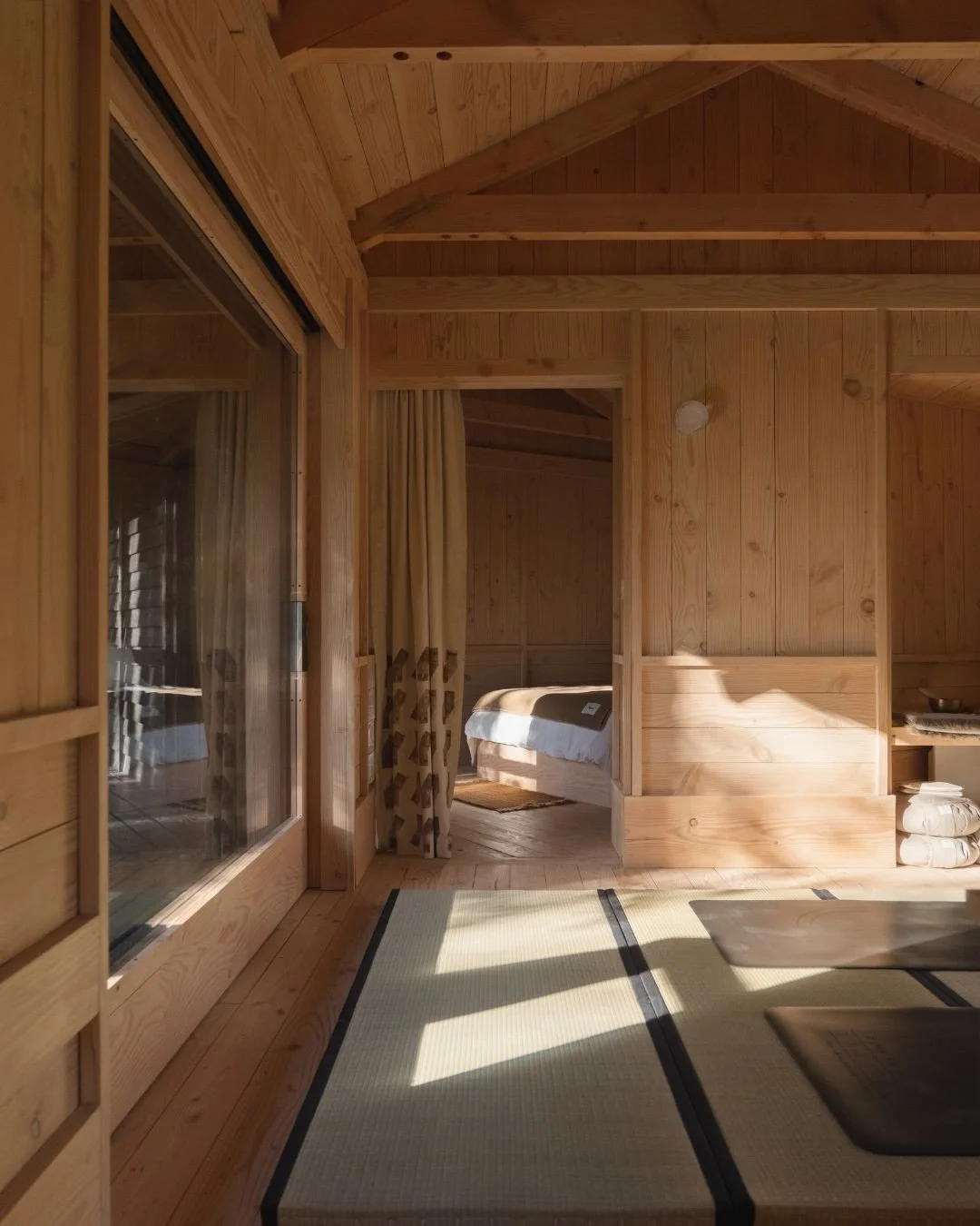 Yogi&rsquo;s Cabin opened its doors last week. Behind the design was a simple intention, to build a space around its setting.

Running east to west, the cabin moves with the light. Large sliding doors open to the engawa deck on either side, framing v