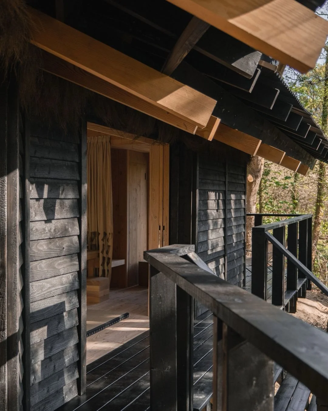 Built to settle quietly into its setting, Yogi&rsquo;s Cabin was designed with sustainability at its core.

The larch cladding was sourced from the adjacent woodland, milled on site and hand torched using the traditional Japanese technique shou sugi 