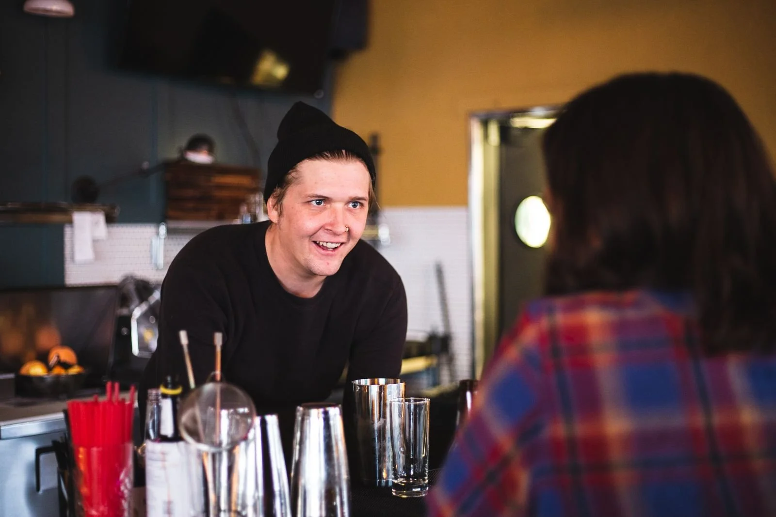 Bartender sharing a laugh with a regular at The Royal Room in Tucson