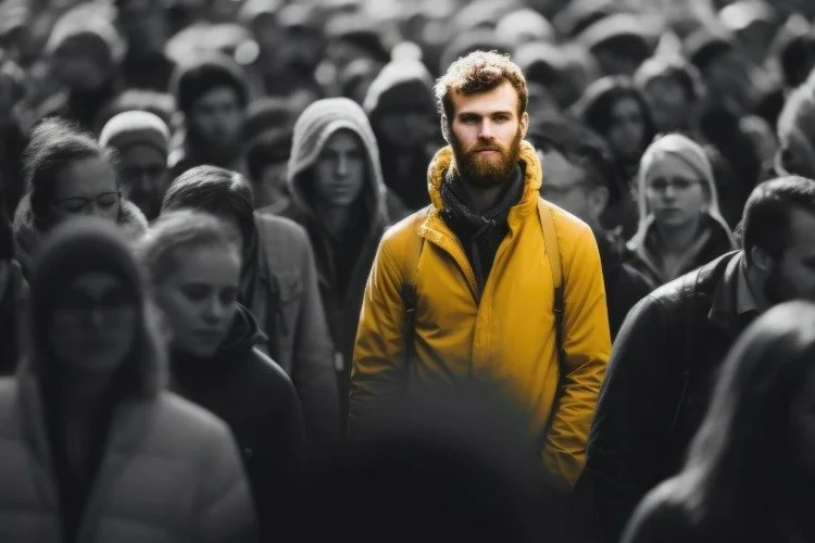 man standing in a busy crowd