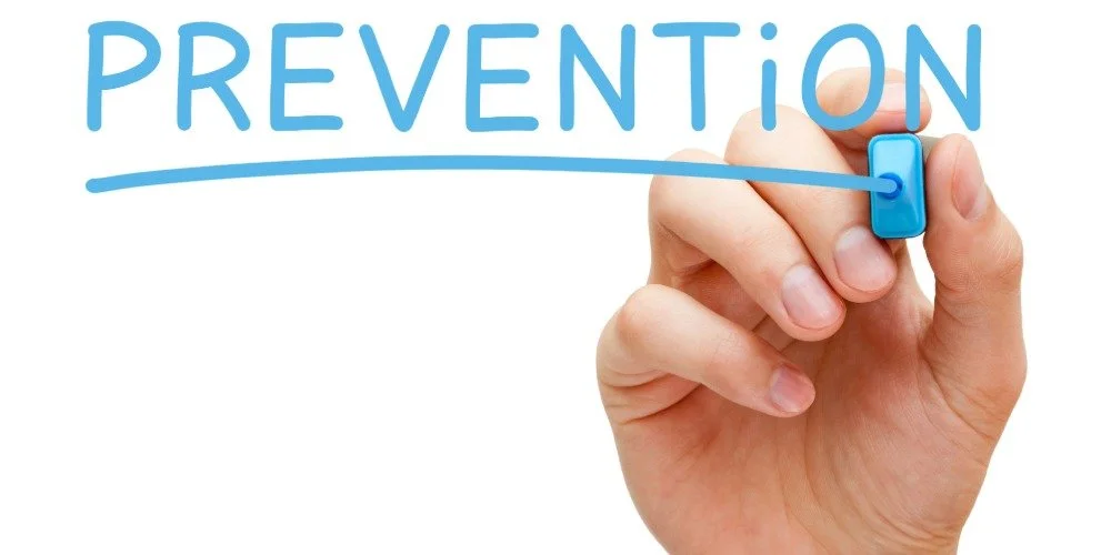 hand with sharpie writing "prevention"