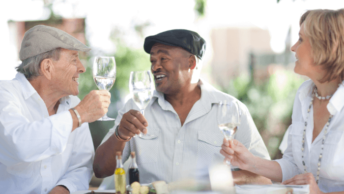 older folks celebrating with wine