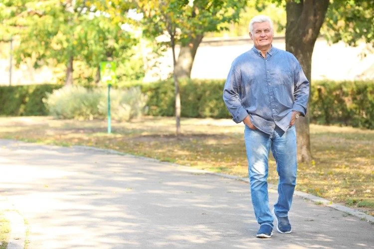 man walking down street