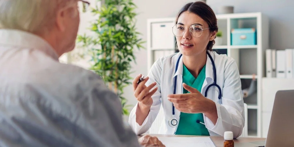 person talking with their doctor