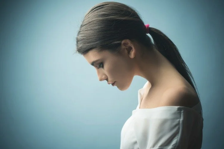 woman looking downward