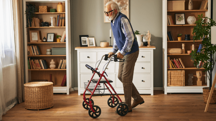 older man walking with a walker