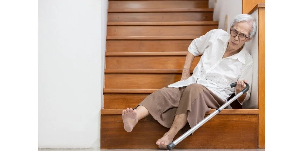 older woman on stairs after a fall