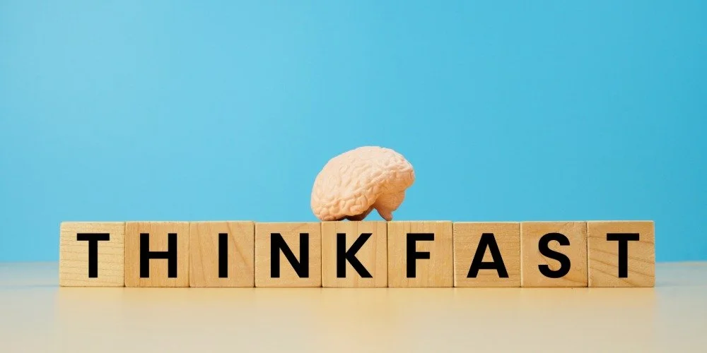 wooden blocks that spell out think fast with a brain sitting on top