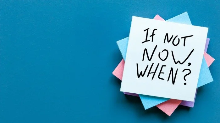 pile of sticky notes that say, "If not now when?"