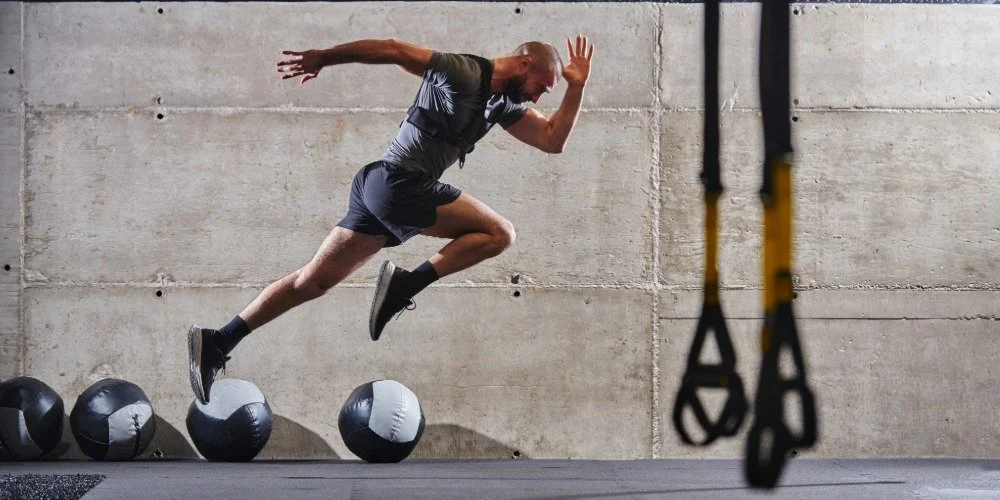 man doing power jump training