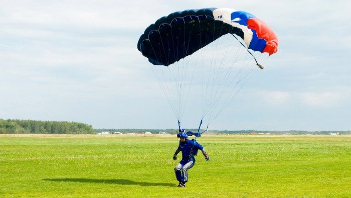 skydiver lands safely on the ground