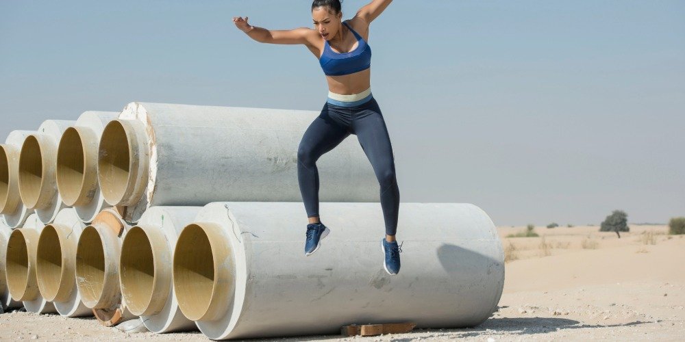 woman landing from a high jump