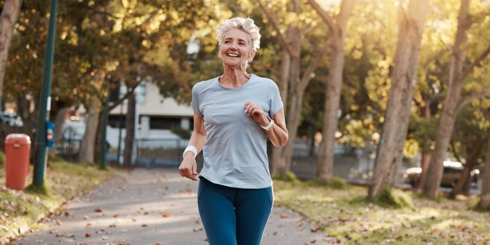 older woman running in the park