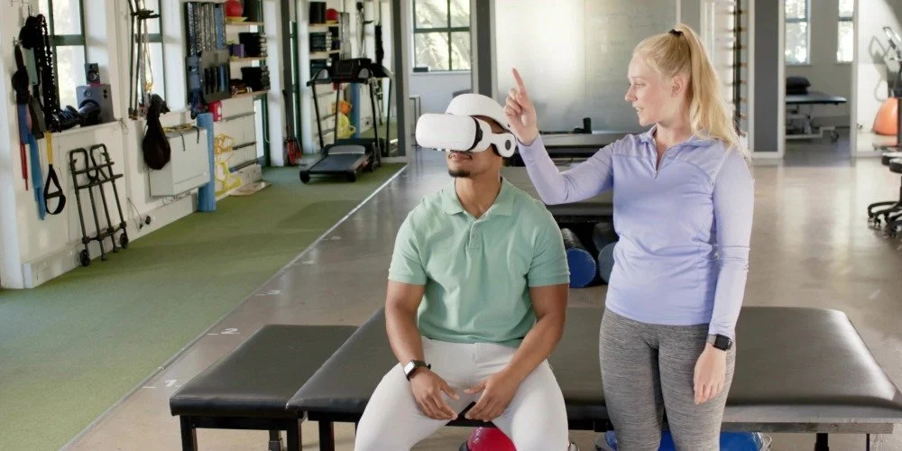 patient and therapist in clinic with VR headset