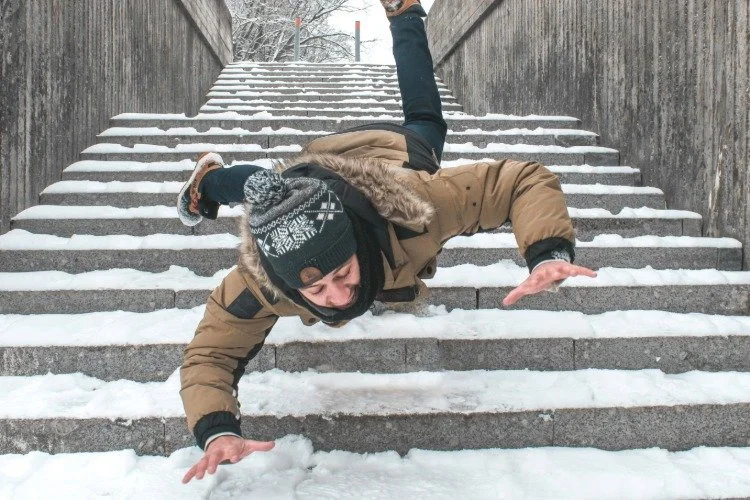 person falling in the snow