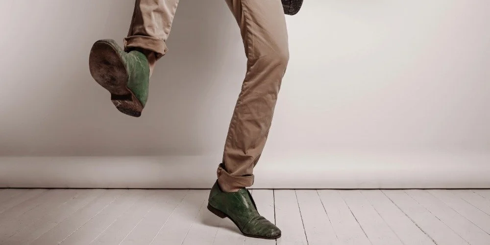 person falling on one leg