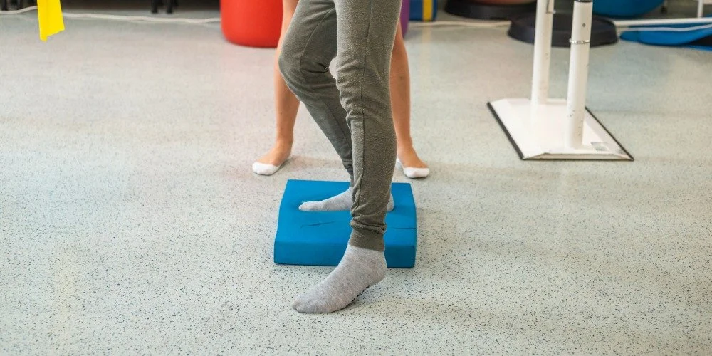 person balancing on foam pad