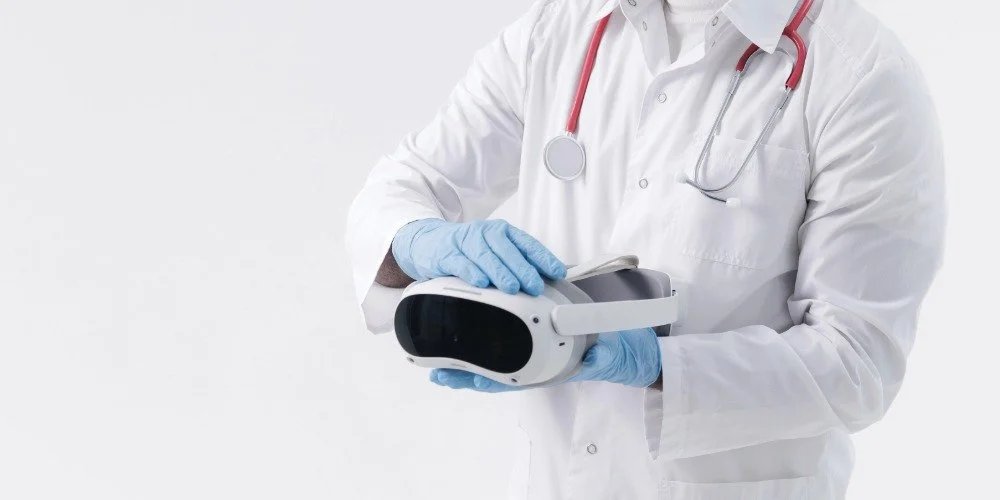 healthcare worker holding a VR headset