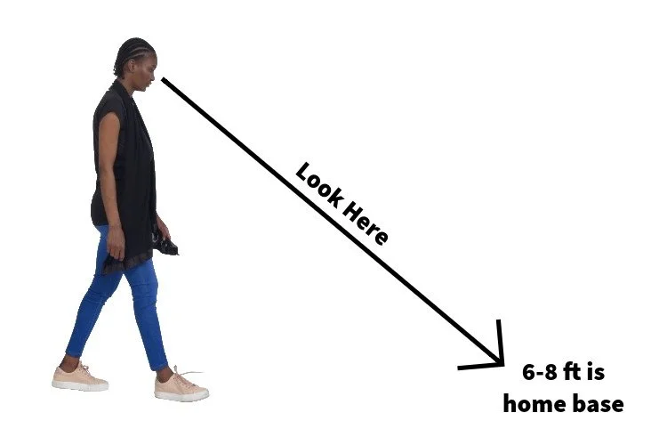 woman looking 6-8ft ahead while walking