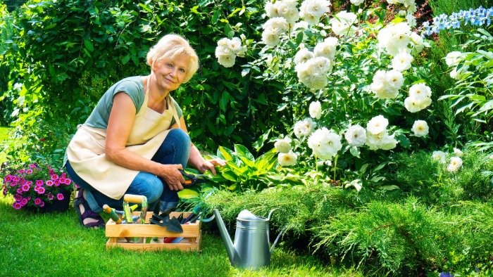 woman confidently gardening on the ground