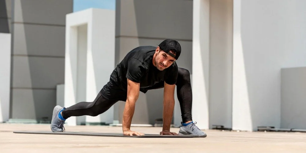 man doing hip mobility exercises