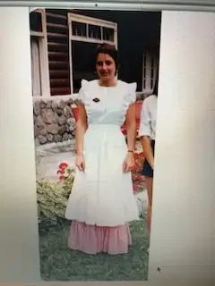 Historic photograph of a staff member in period-inspired attire, reflecting the inn's heritage, traditions, and long-standing commitment to guest service.