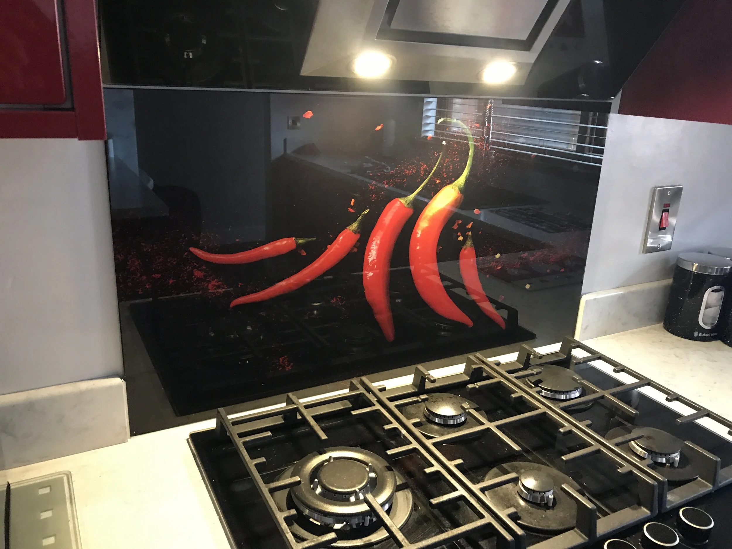 Single splashback adds colour and keeps cost down for any kitchen.