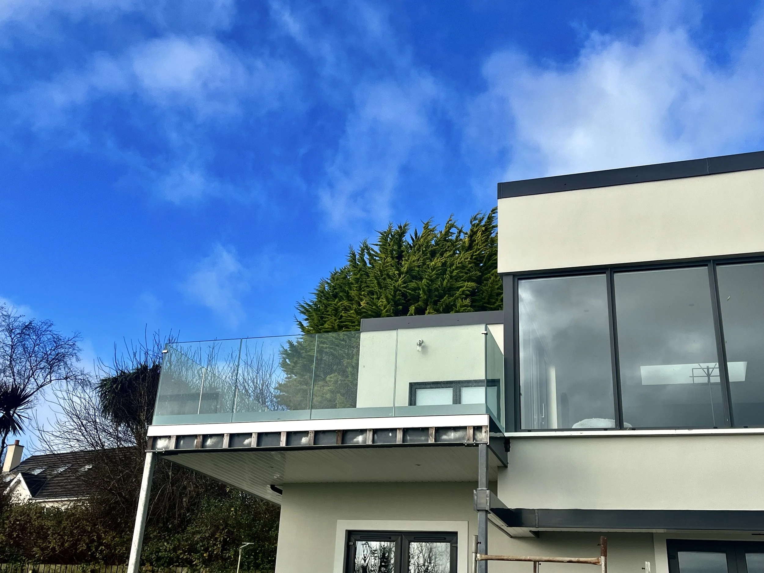 Beyond the Bars: Why Glass Balconies Reign Supreme over Metal Railings In Northern Ireland 