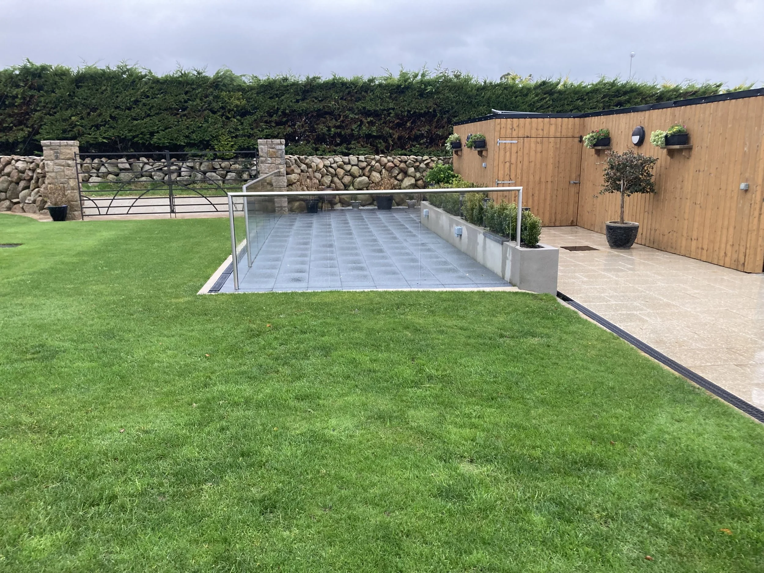 Glass Balustrade in your garden can provide many functions