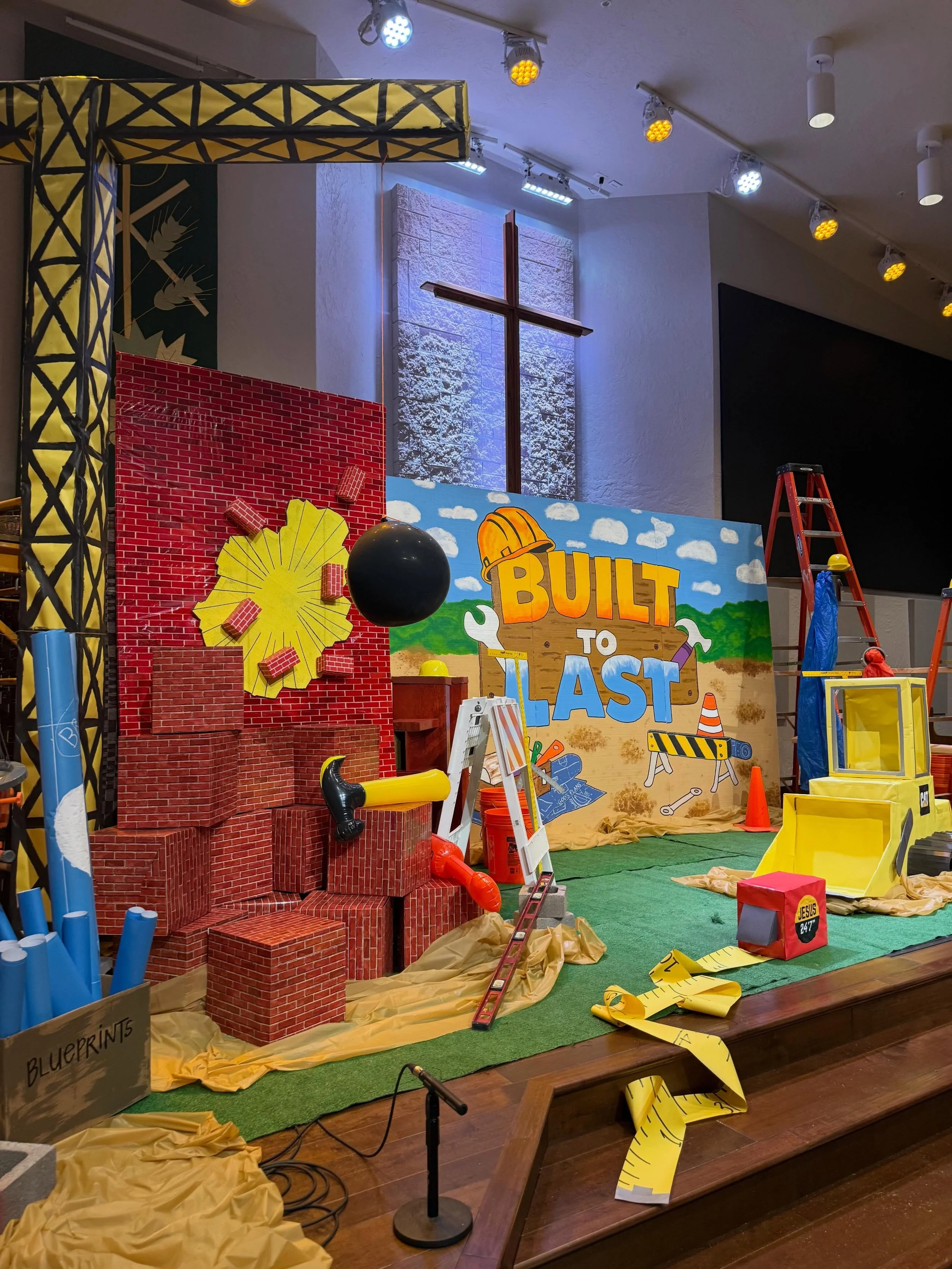 &rsquo;Twas the night before VBS, and all through the church,
The leaders were finishing one last-minute search.

The hammers were ready, the hard hats in rows,
The stage was all set for tomorrow&rsquo;s grand show.

The crafts had been counted, the 