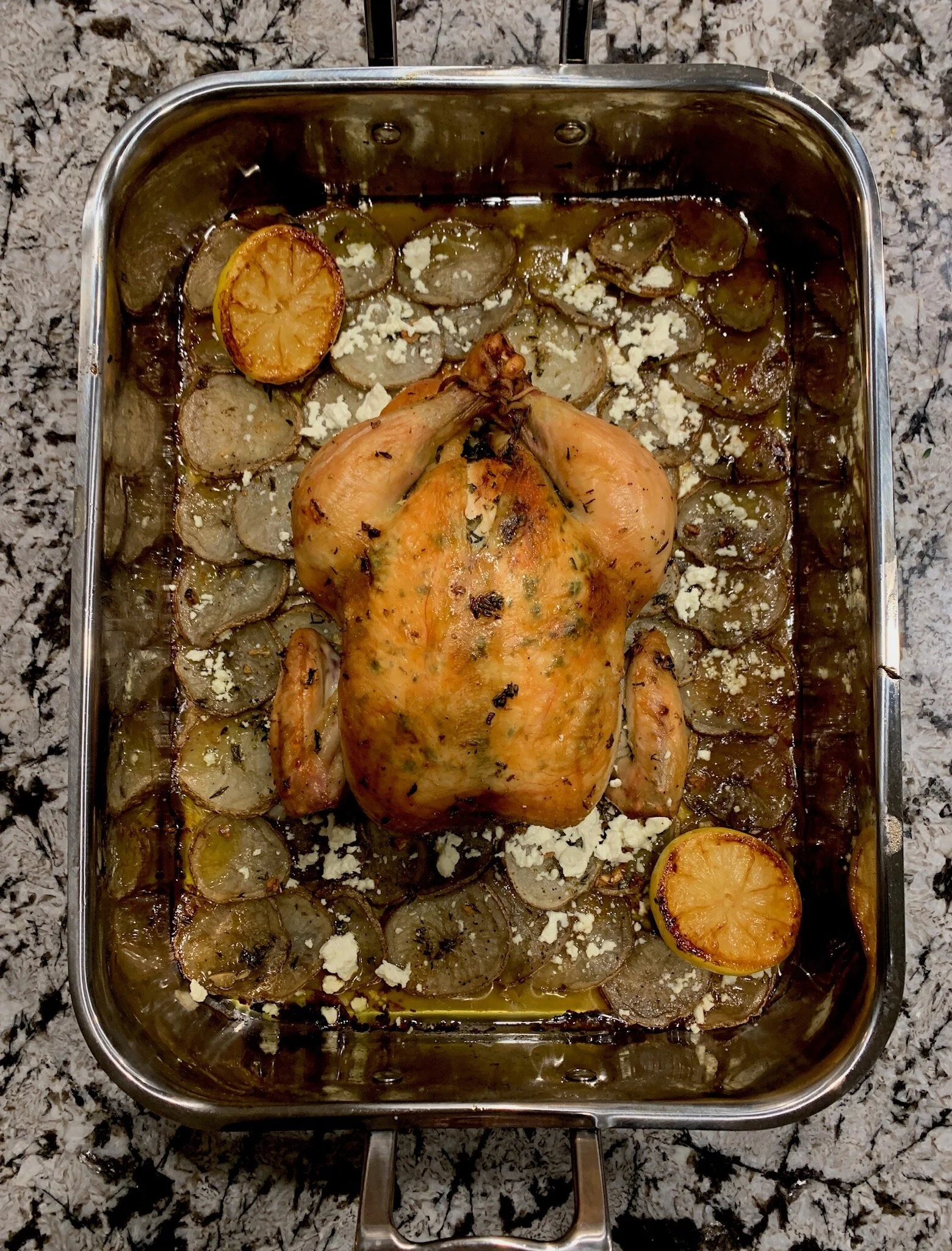 She’s thick, she’s juicy, she rests on her potato bed. She’s the Greek Roast Chicken.