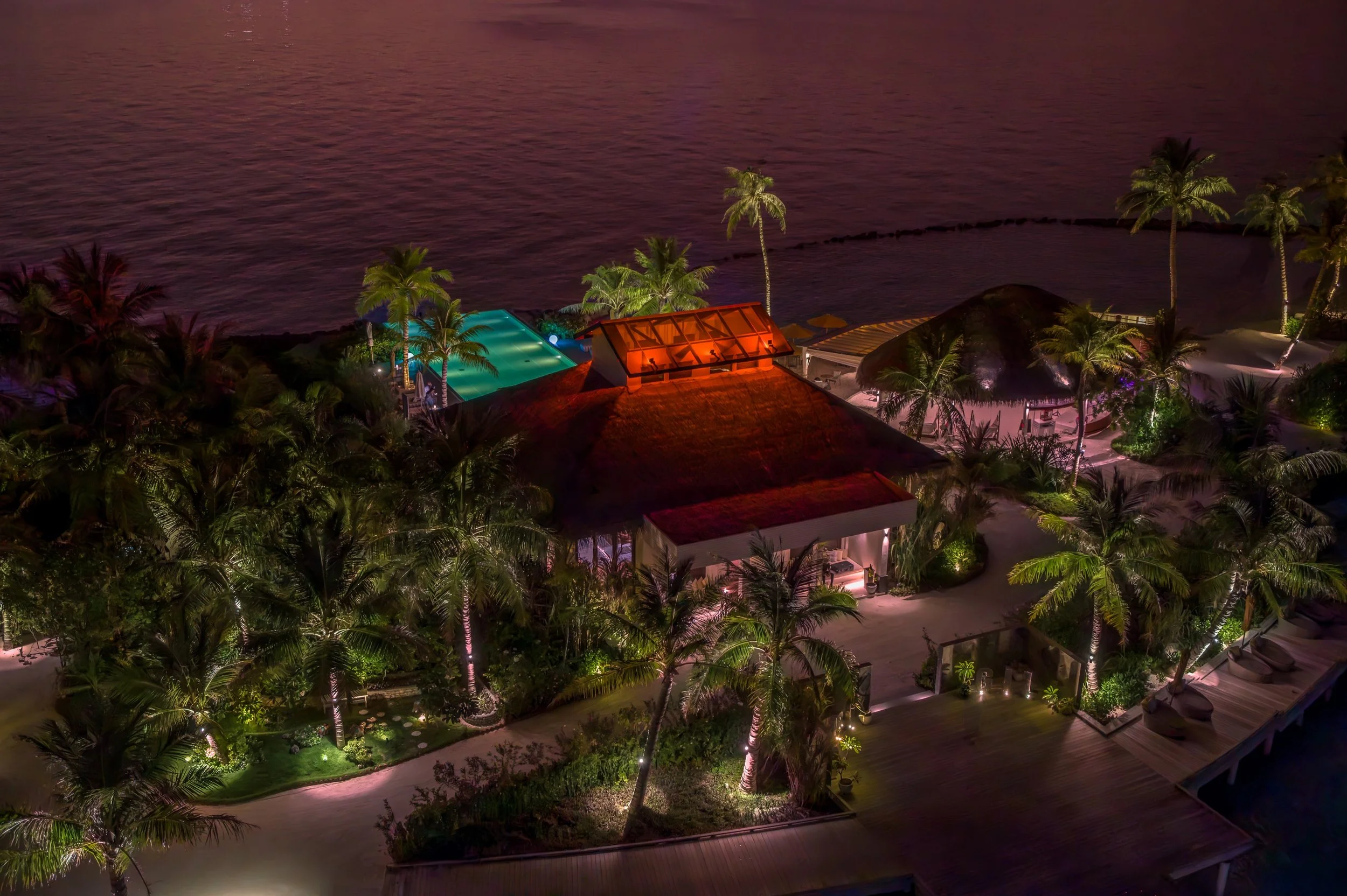 As daylight fades, the island reveals another kind of beauty warm lights, deep shadows, and the endless Indian Ocean beyond.