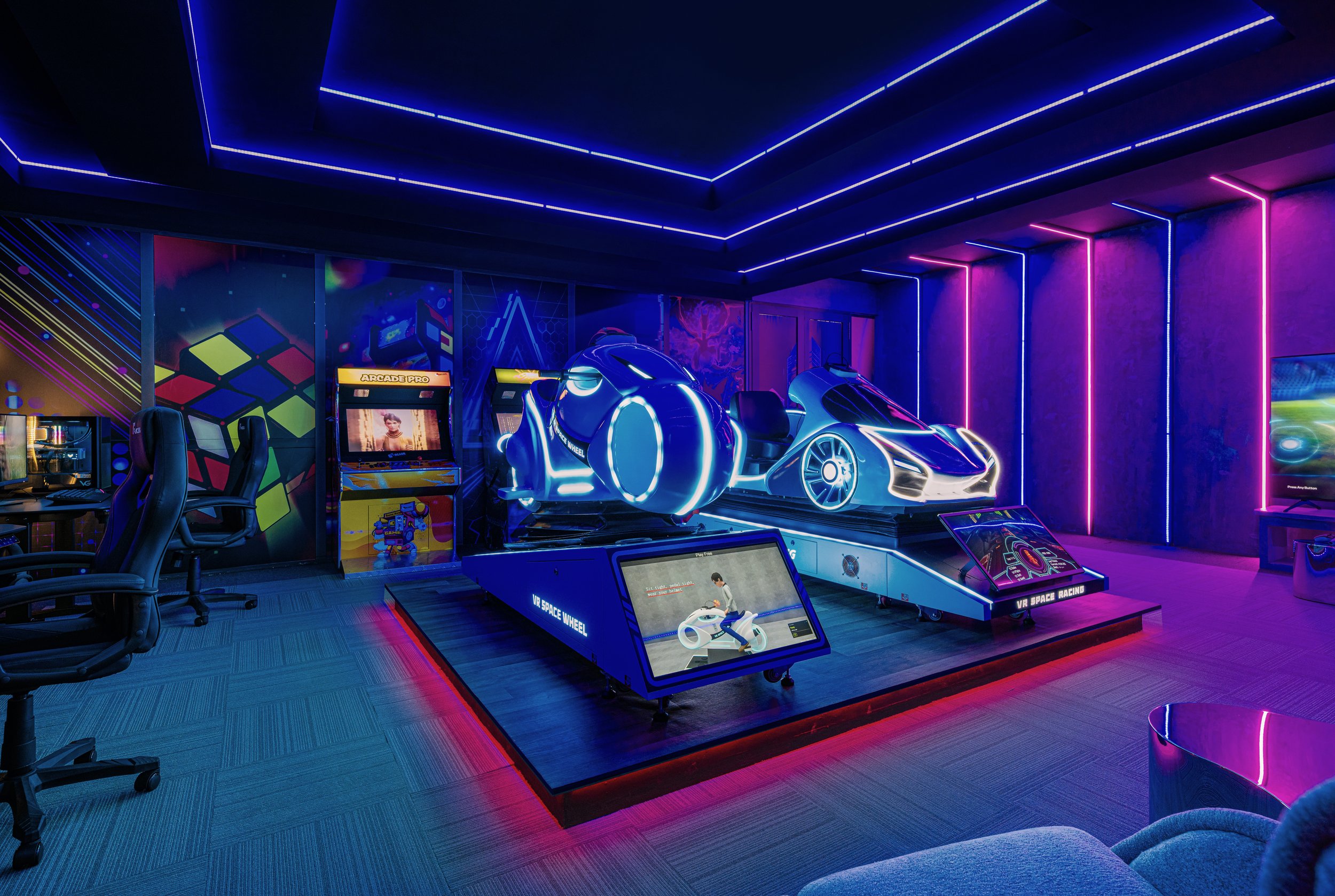 A neon-lit arcade room featuring a futuristic racing game with glowing cars, arcade machines, gaming chairs, and digital screens.