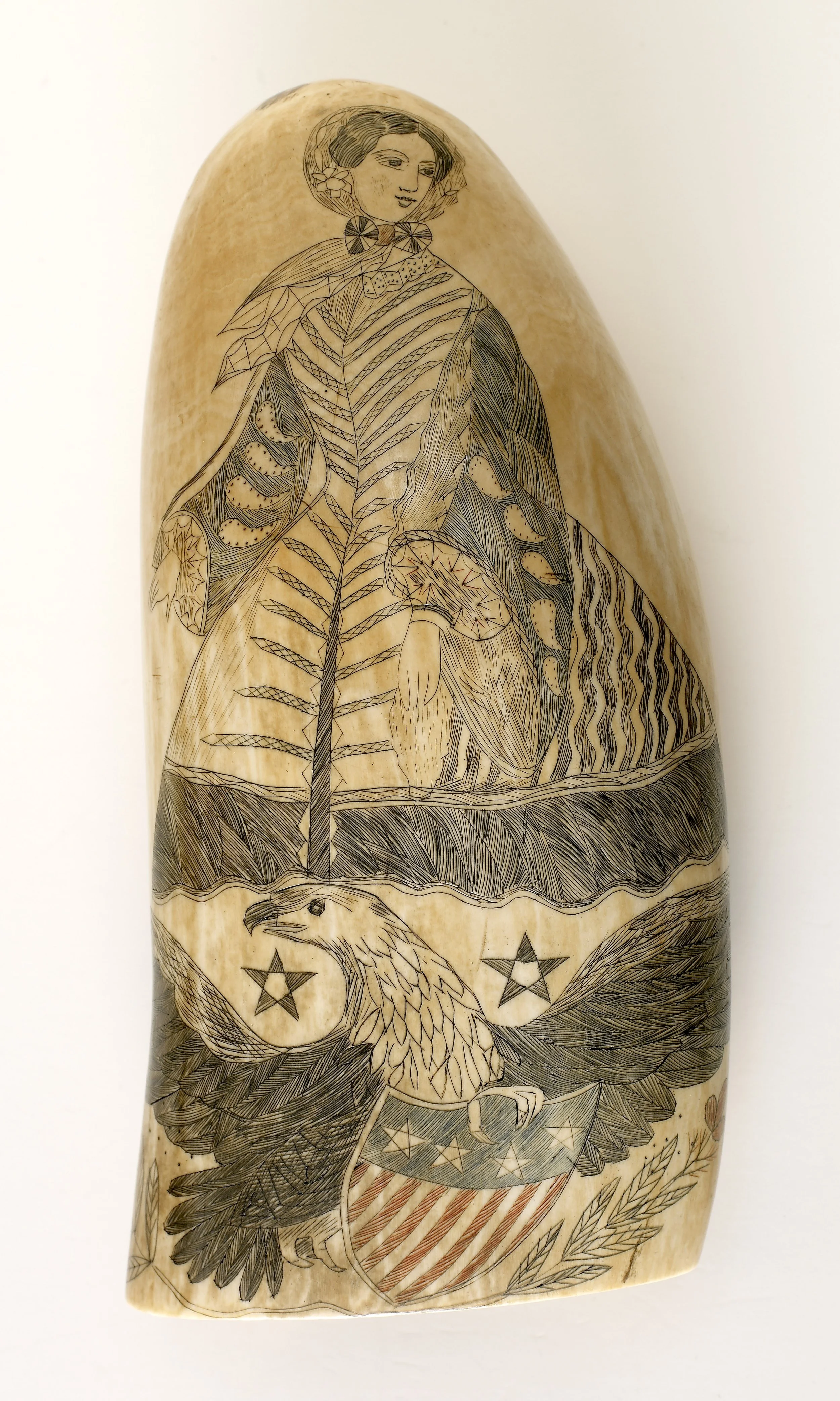 Decorated sperm whale teeth depicting a fashionable American lady.jpg