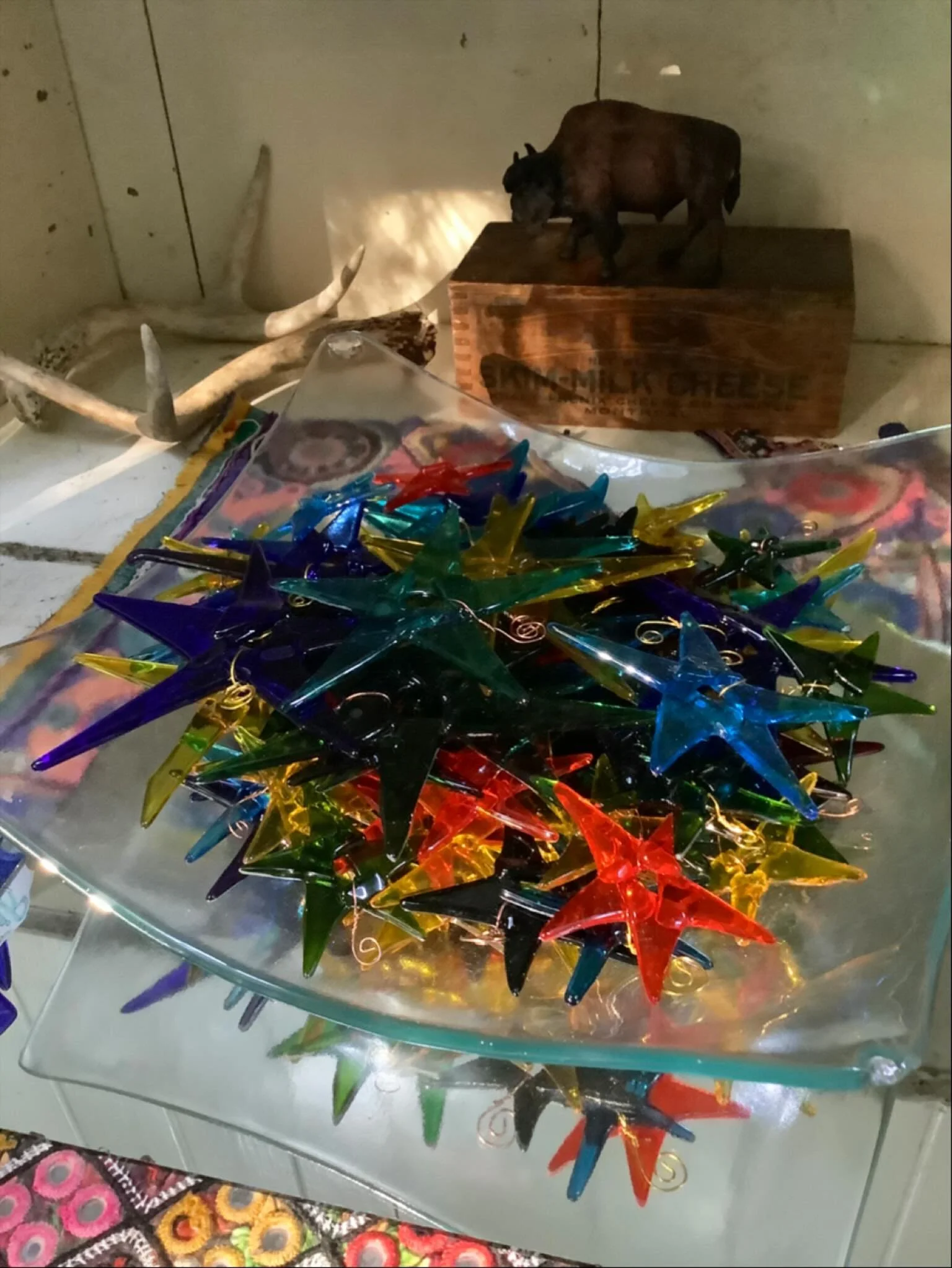autumn equinox morning light casting a glow on #fusedglass stars. 

I&rsquo;ve been making glass #stars every year for over 20 years. In a way, I could liken the process of making the stars to slow stitching. It&rsquo;s soothing to me, a skill I&rsqu