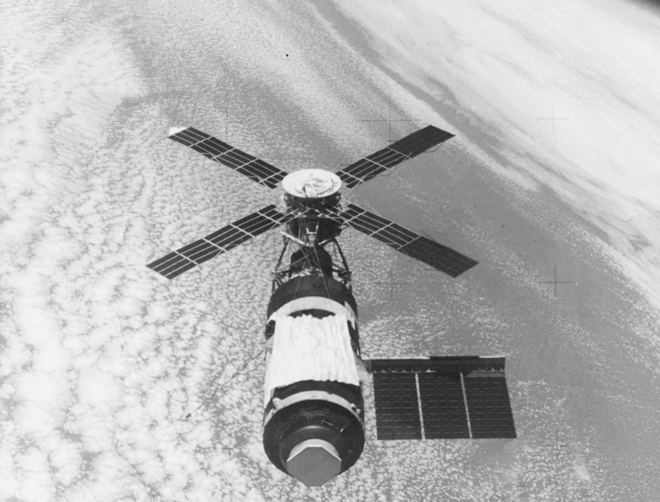 A satellite with solar panels floats in space signifying a platform analogy.