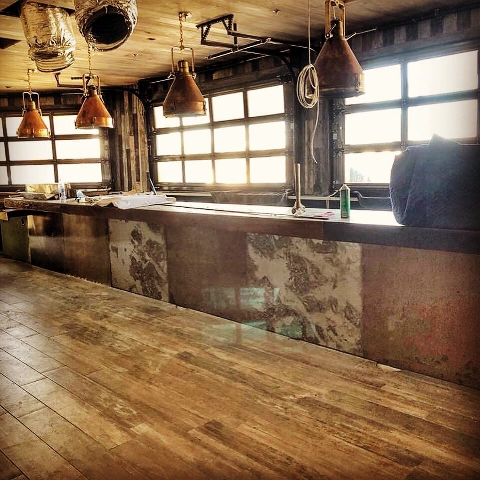 Progress made is a day well played, everyone, and this here is progress.

The motif and aesthetic are coming together beautifully. Little flourishes being added daily, floor to be done soon, and that rustic patina on the front of the bar? Authentic a