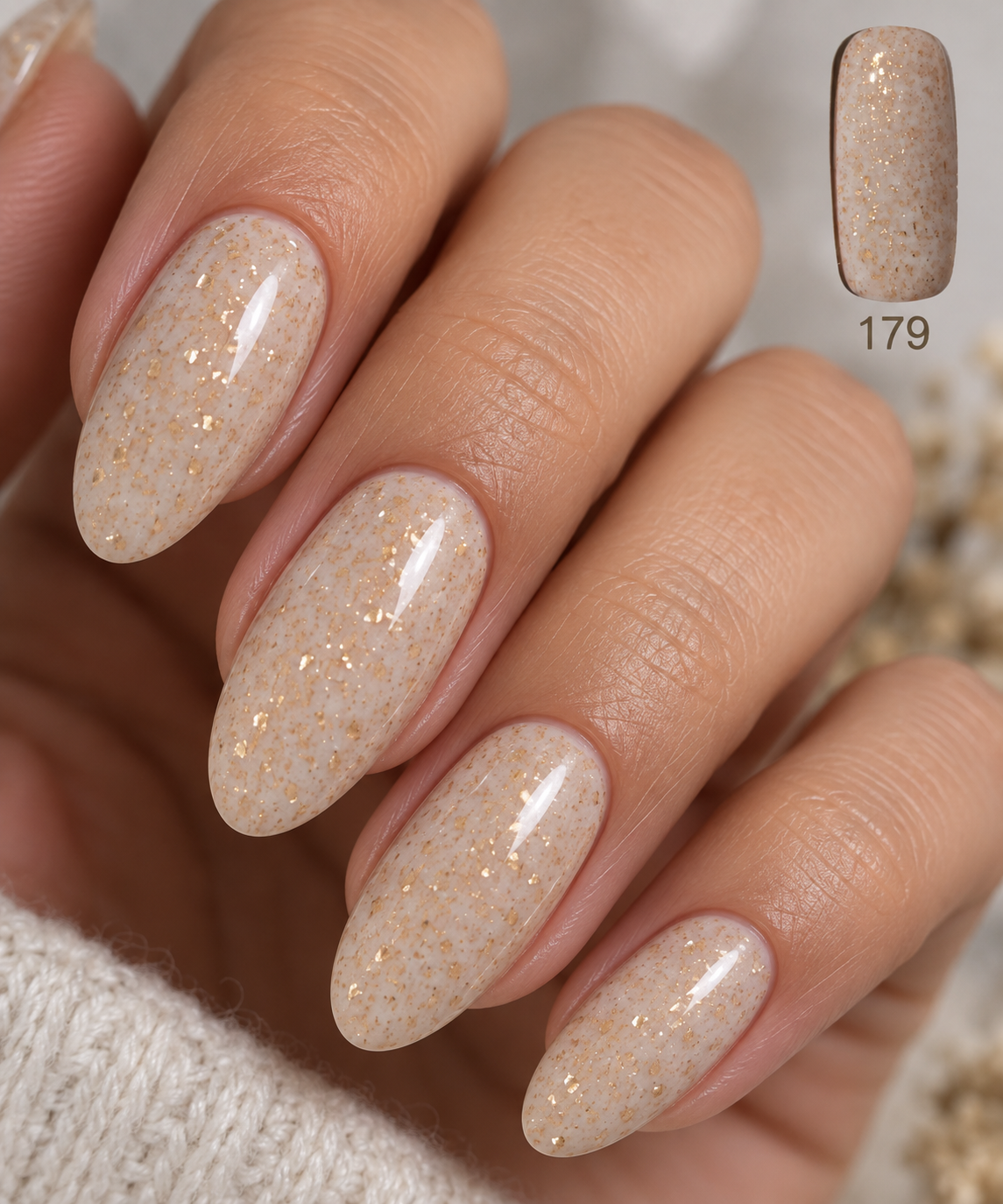 Close-up almond nail with Gelosophy #179 Timeless in Luxe nude gold fleck gel manicure