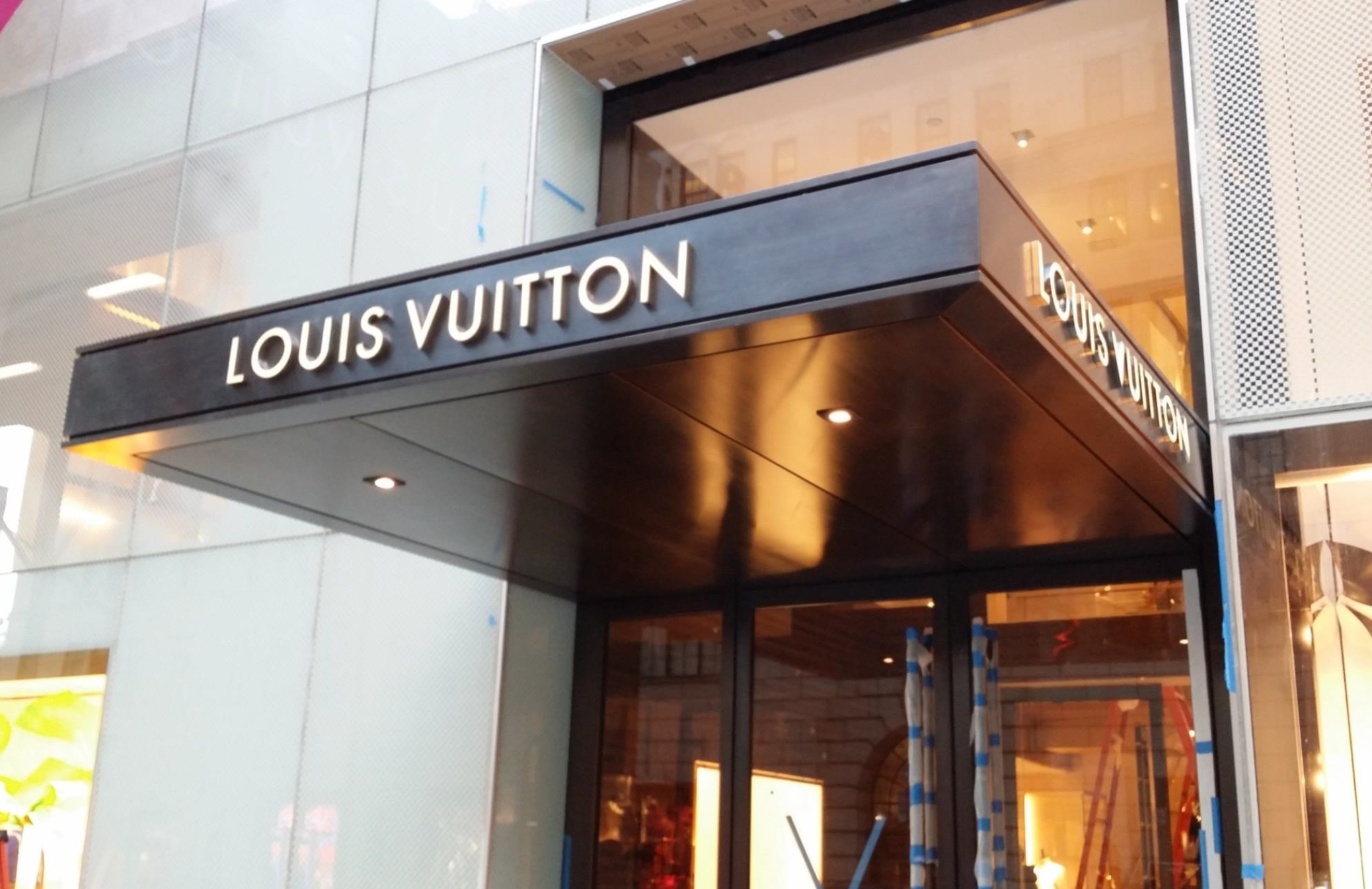 Out and About in 5th Ave. Louis Vuitton building decoration. The changing  face.