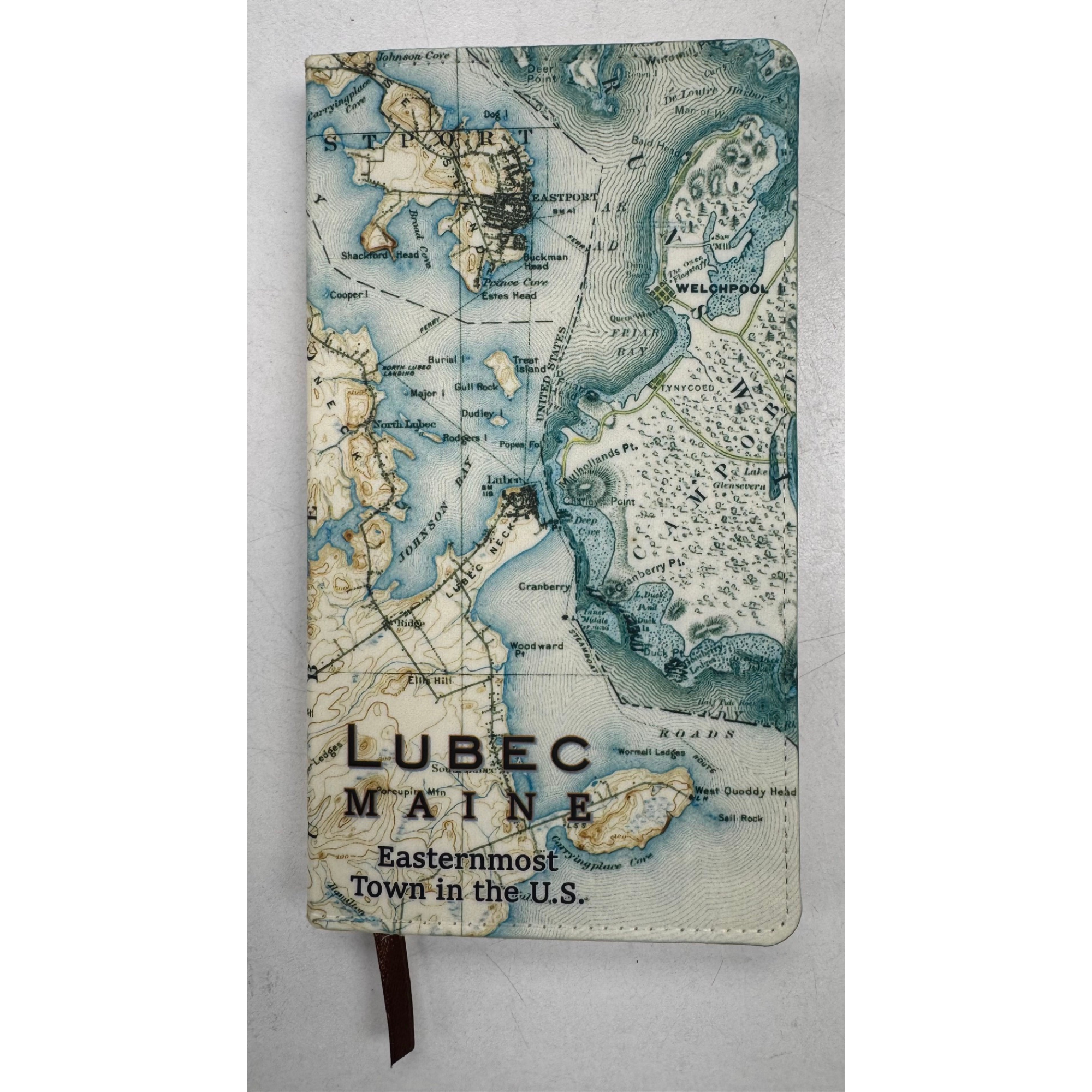 A souvenir journal with a vintage map of Lubec, Maine, featuring detailed topography and water bodies, with text indicating it as an easternmost town in the U.S.
